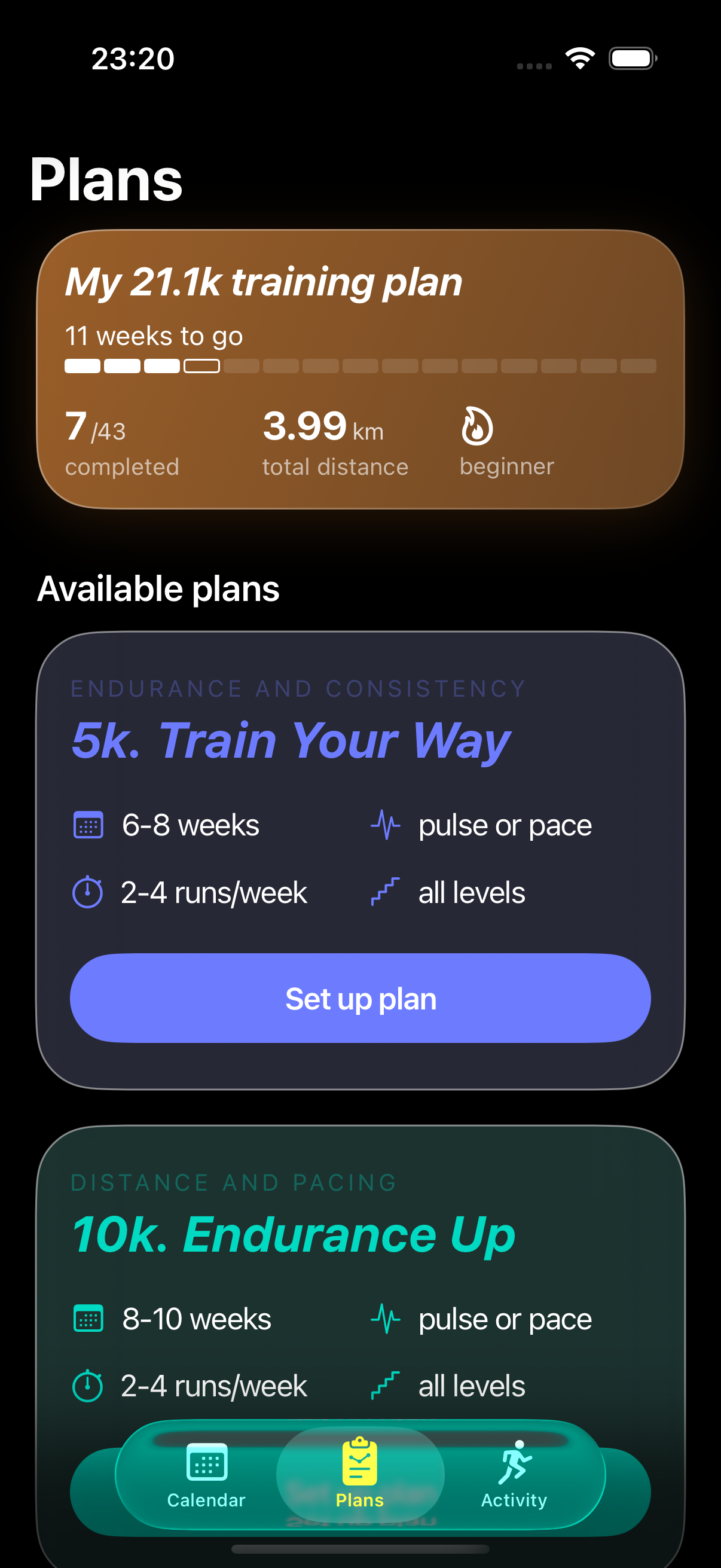 The same iOS 26 Plans tab in dark mode — same orange-gradient active plan card, the same purple and teal glass panels, all rendered against a black background with the gradients faintly visible as ambient light leaking out from each card.